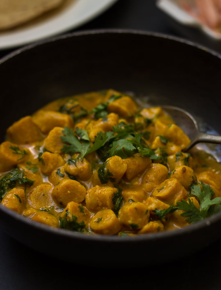 Gatte Ki Sabji served in a traditional Indian bowl, garnished with fresh coriander