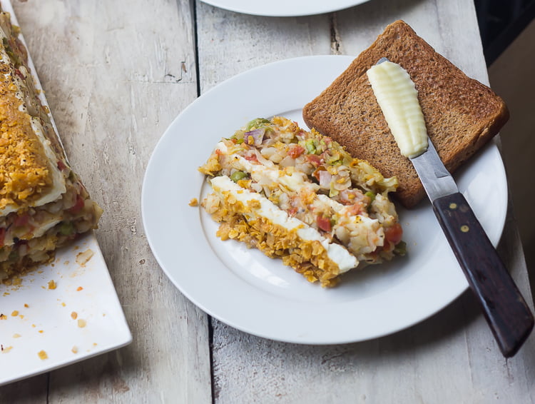 Slices of baked vegetable loaf arranged neatly on a plate