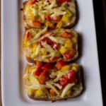 A close-up shot of crispy edges on Garlic Chilli Cheese Toast
