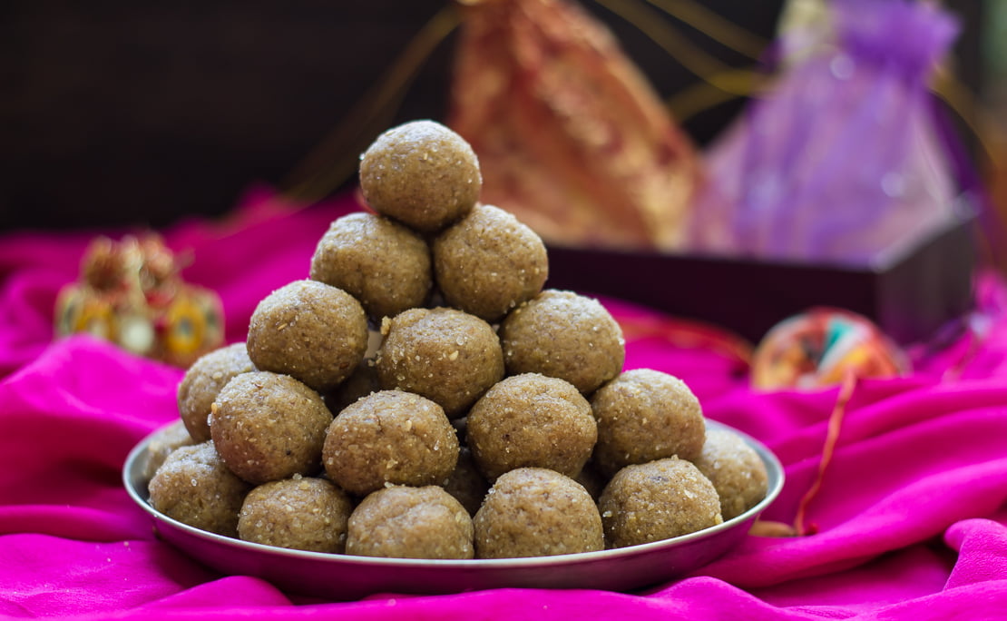Close-up of sesame seeds sticking to the laddus