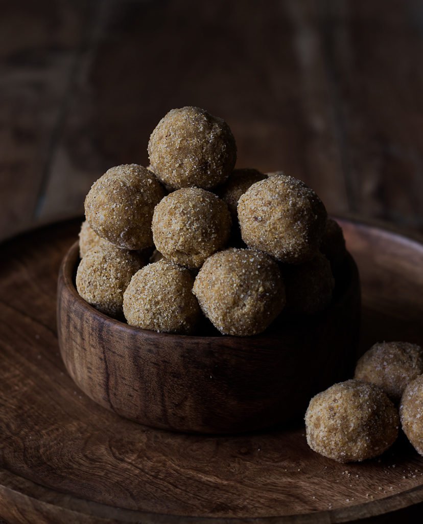 Til ke Laddu stacked in a pyramid shape
