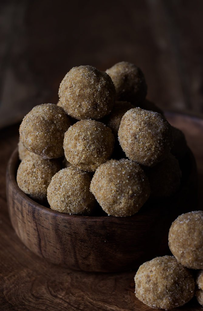 Close-up of freshly made Til ke Laddu stacked on a plate