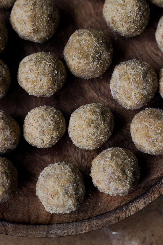 Close-up of sesame seeds sticking to the laddus
