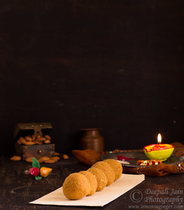 Close-up showing the crumbly and rich texture of a besan ladoo.