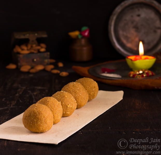 Close-up showing the crumbly and rich texture of a besan ladoo.