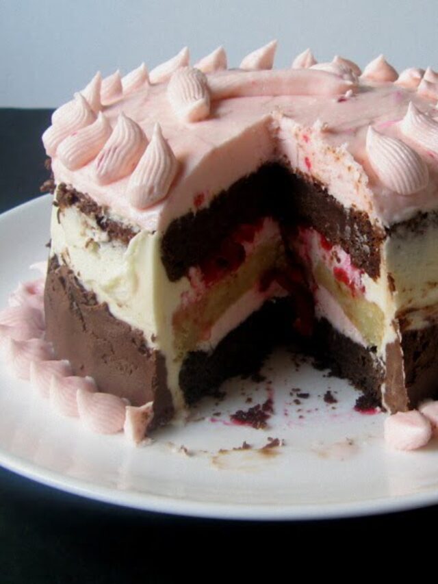 A beautifully layered Eggless Neapolitan Cake with chocolate, vanilla, and strawberry layers
