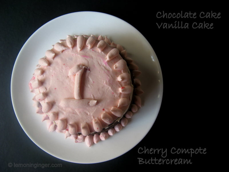 Top view of an Eggless Neapolitan Cake with smooth frosting and garnishes