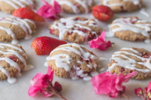 Fresh strawberries and baked scones styled in a decorative arrangement