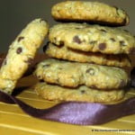 Freshly baked oatmeal chocolate chip cookies stacked on a plate