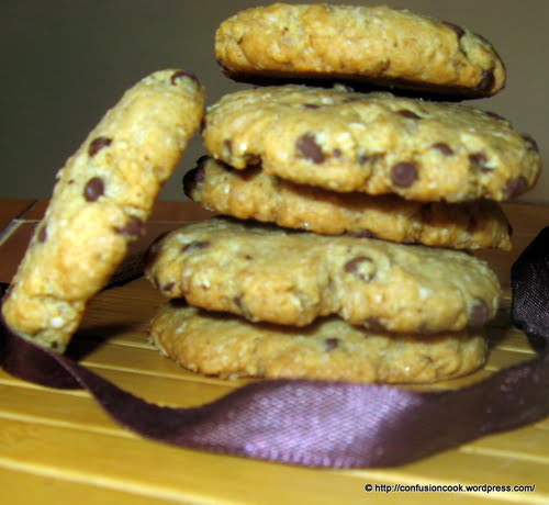 Close-up of chewy chocolate chip oatmeal cookies with golden edges