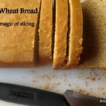 Rustic whole wheat bread loaf on a baking tray, fresh from the oven