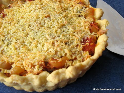 Close-up of a slice of Pasta Tart, showcasing the layers of pasta and cheese