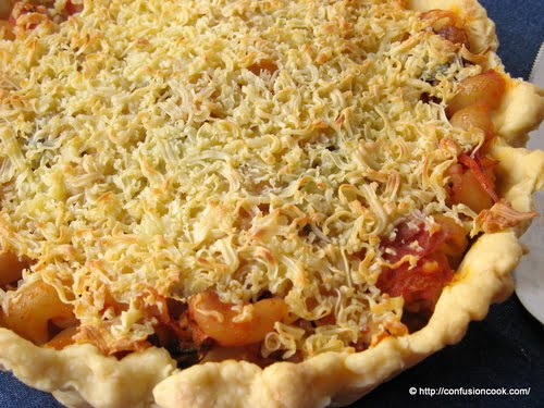 A forkful of Pasta Tart, highlighting the rich and creamy filling