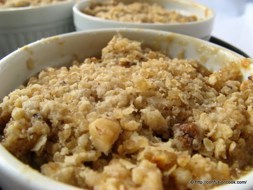 Crispy crumble topping over juicy apple and pear filling