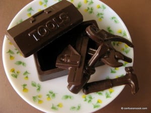 Homemade chocolate bars in geometric molds on a cooling rack