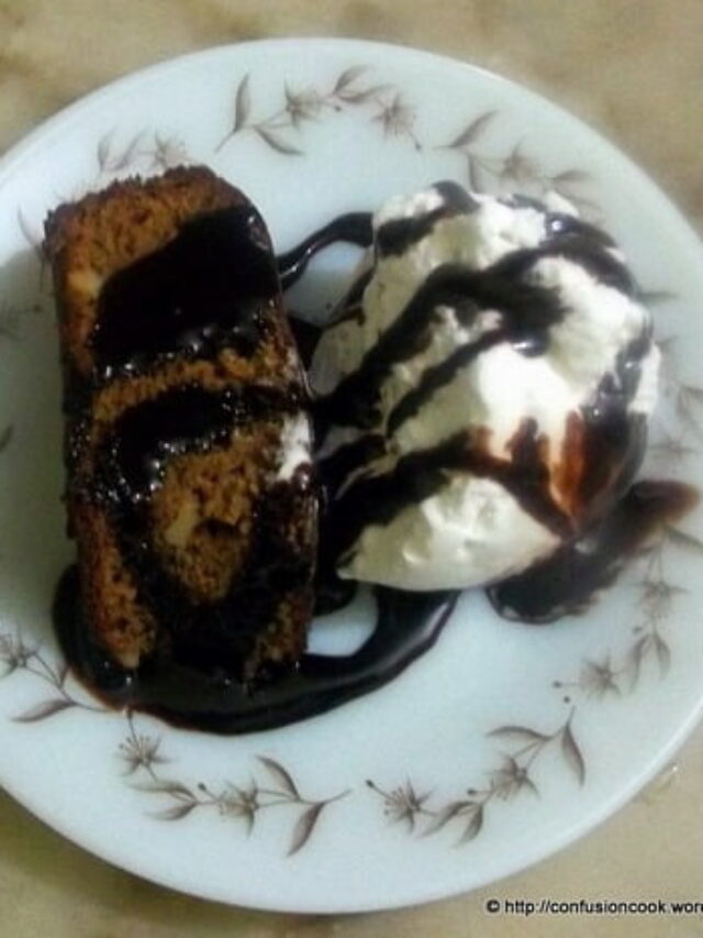Close-up of fudgy chocolate brownie cake with glossy top.