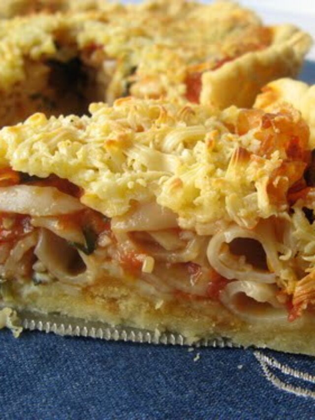 A slice of Pasta Tart, highlighting the rich and creamy filling