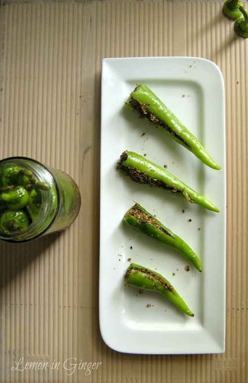 Process of stuffing green chilies with spice mixture for making achar