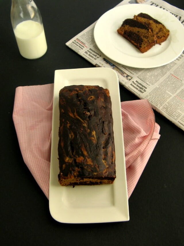 Marbled banana bread with vanilla and chocolate swirls on plate