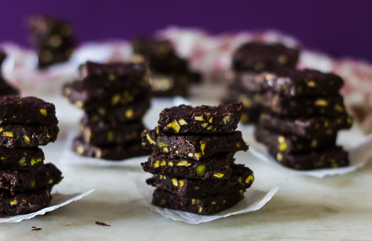 Chocolate fudge cubes with a glossy top and crunchy nuts