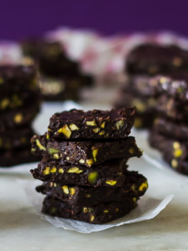 Chocolate fudge cubes with a glossy top and crunchy nuts