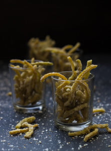 Candied orange and lemon peels drying on a wire rack