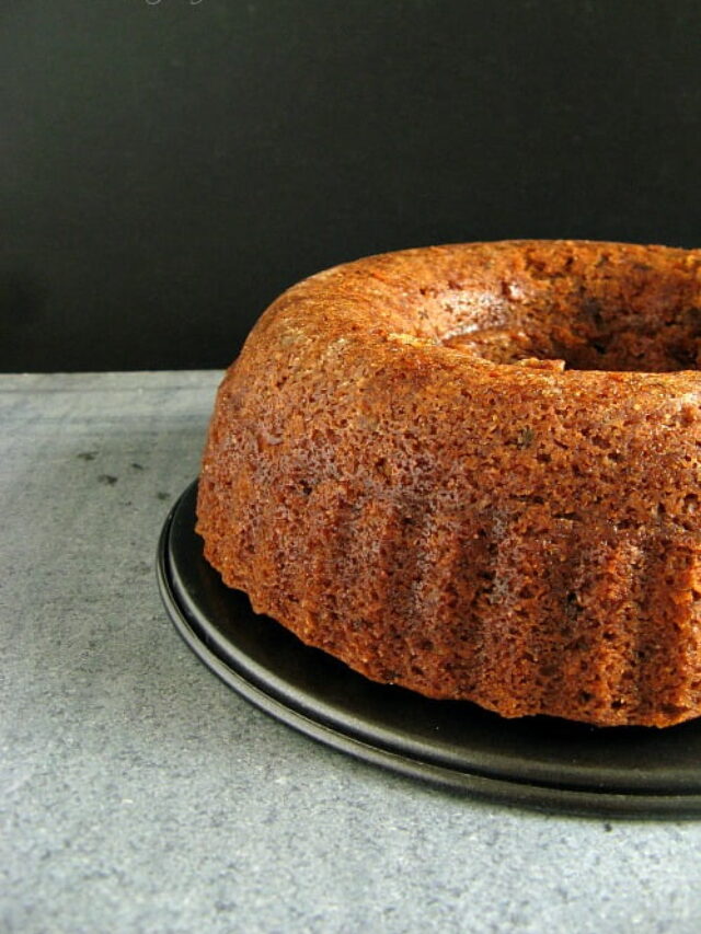 Eggless Whole Wheat Christmas Bundt Cake with a glaze drizzled over the top