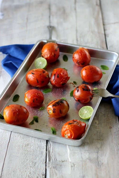 Perfectly blanched tomatoes on a kitchen counter, ready for cooking