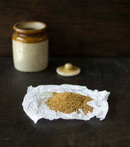 Close-up of freshly ground cumin powder in a bowl