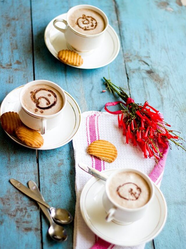 Thick and velvety hot chocolate in a glass mug with grated chocolate on top