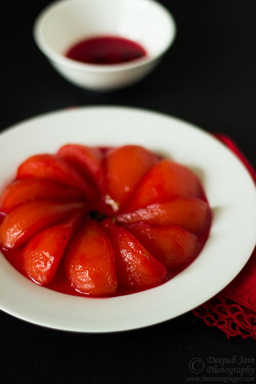 Homemade poached pears in white wine ready to serve