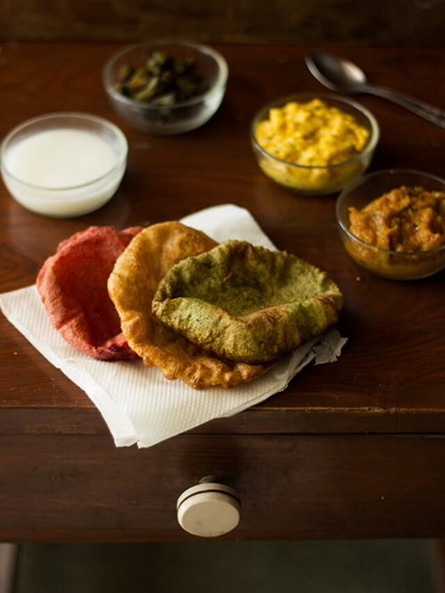 Close up view of palak and beetroot puris