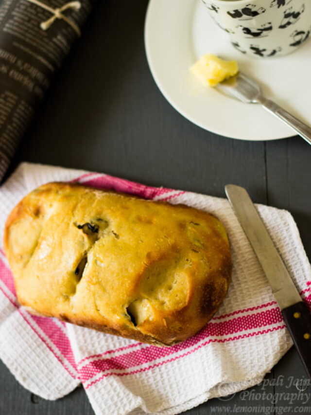 Easy no-knead olive bread baked golden in a rustic loaf