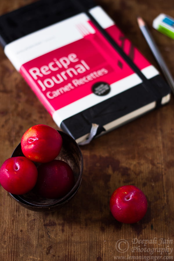 Overhead view of baked apple plum crisp in a ceramic dish