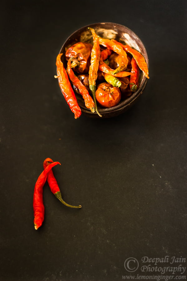 A final display of fully dried red chilies arranged neatly in a bowl