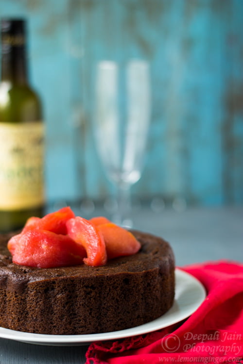 A whole gluten-free amaranth chocolate cake decorated with pear