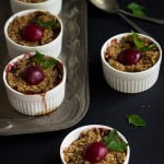Rustic presentation of plum and apple crumble in a wooden bowl