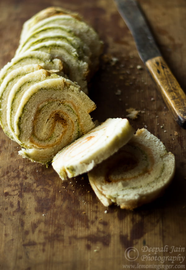 Pinwheel sandwiches served with ketchup and mint chutney