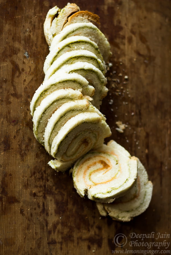 Close-up of colorful pinwheel sandwiches arranged on a white plate
