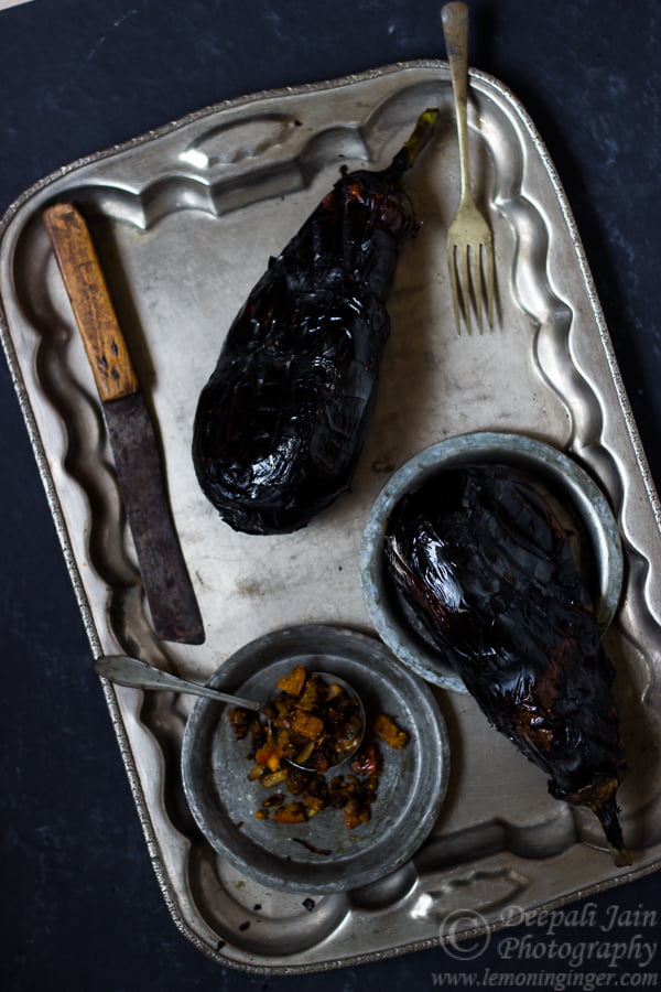 Close-up of an eggplant with blackened, crispy skin after roasting