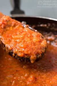 Close-up of the sauce’s rich and smooth texture in a pan