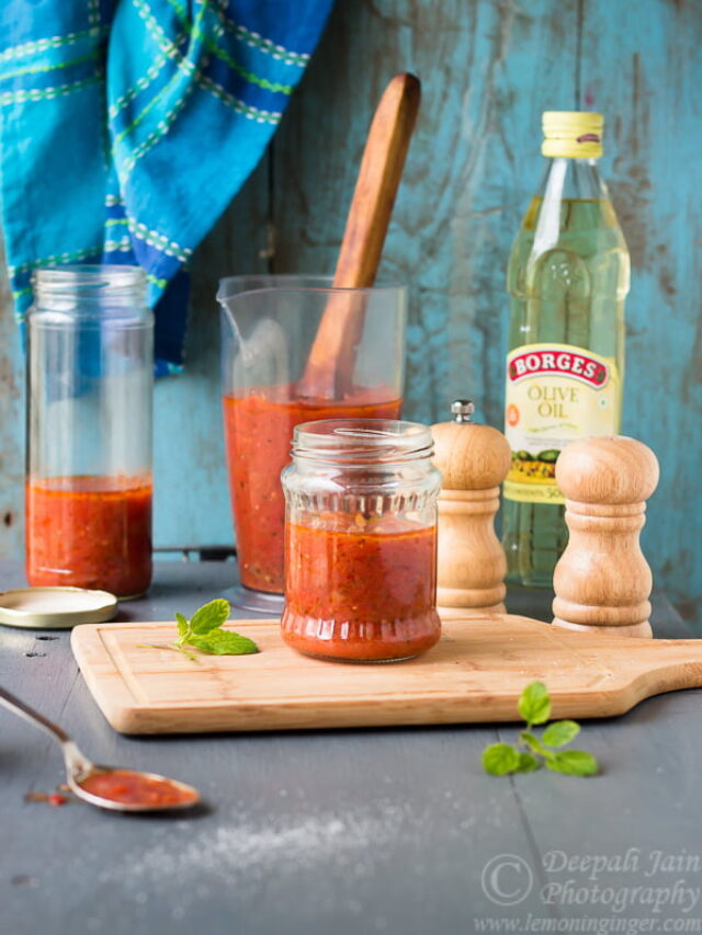 A jar of homemade pizza sauce labeled and sealed for storage