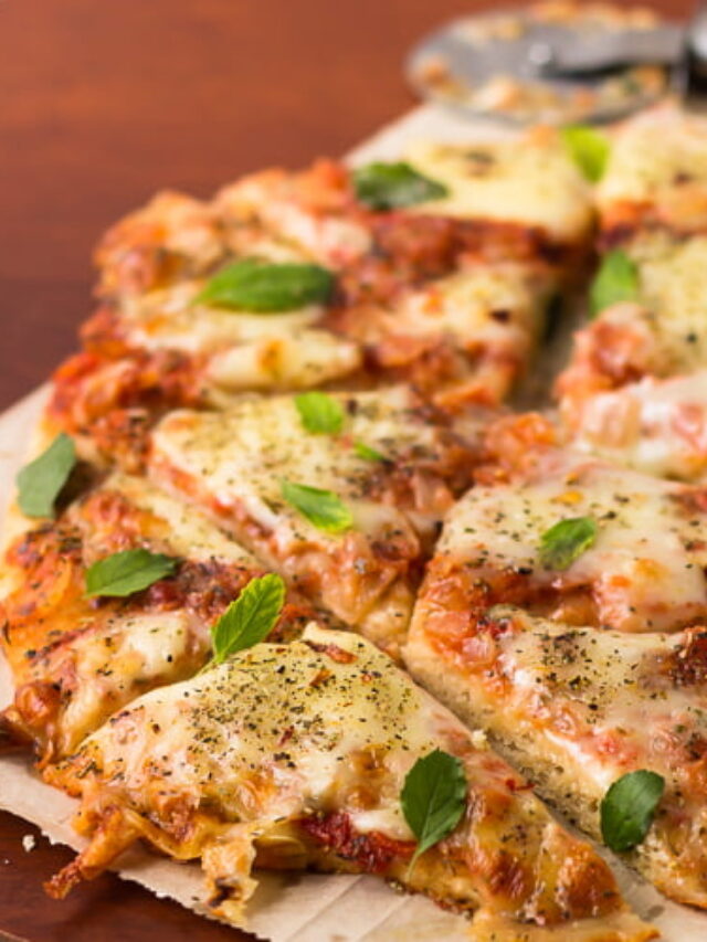 Sliced whole wheat Margherita pizza showing golden crust and melted cheese