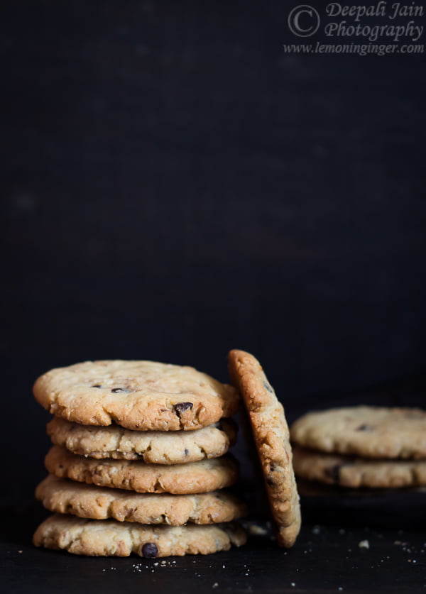 Close-up of freshly baked oatmeal chocolate chip cookies on a baking tray