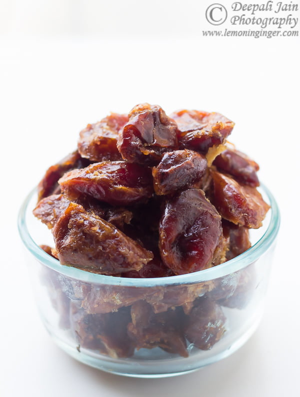 A bowl full of dates arranged in a bowl to make date and walnut cupcakes