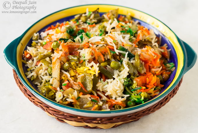 Close-up of vibrant Hyderabadi Veg Dum Biryani garnished with fried onions and coriander