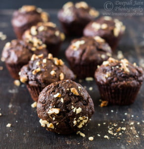 Top view of banana chocolate muffins in parchment liners