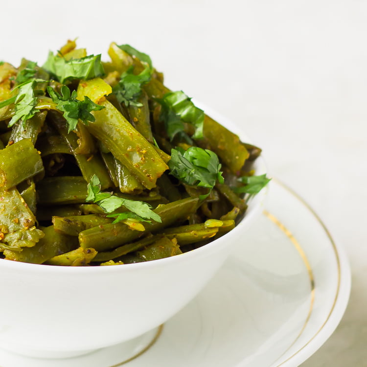 Gawar Phali Ki Sabji served on a traditional Indian dishes