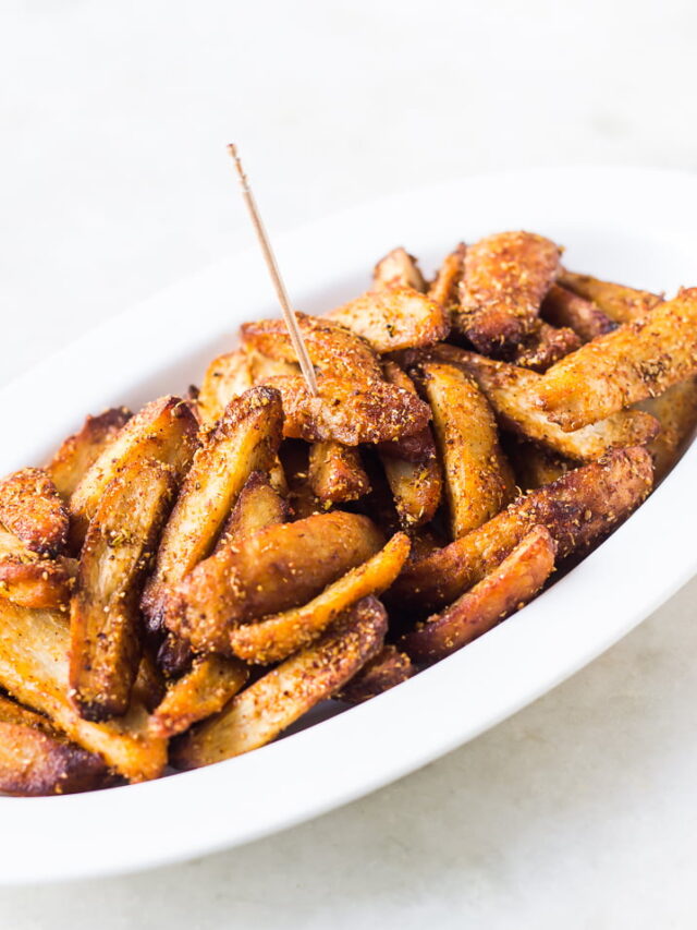 Golden brown Masala Arbi served in a bowl showcasing spices