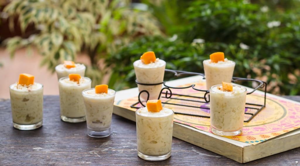 Smooth and creamy pineapple pudding poured into many glasses
